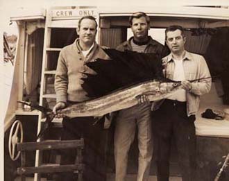 My father (middle) posing with a nice sailfish